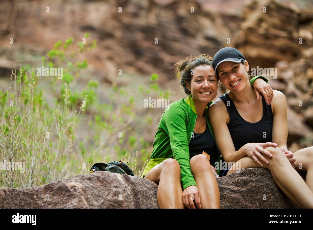 Portrait of two smiling young women Stock Photo - Alamy