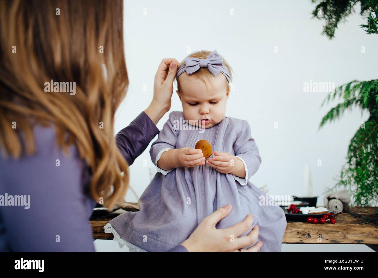 Little baby girl in a blue dress. Happy childhood Stock Photo - Alamy