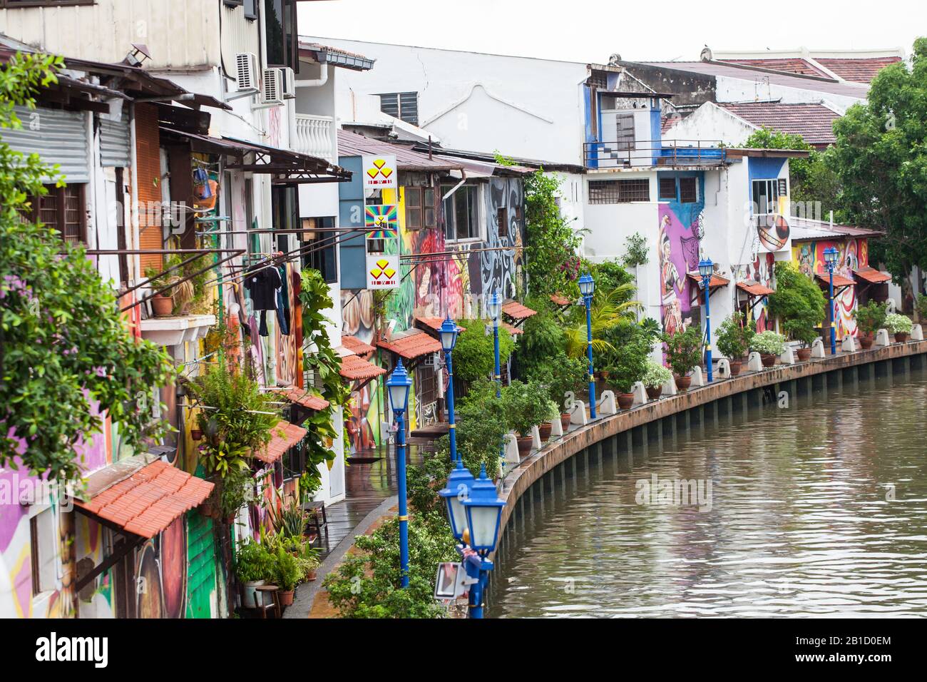 Homes and business along the clean river, district of Kampung Bakar Batu, Malacca or Melaka, Malaysia Stock Photo