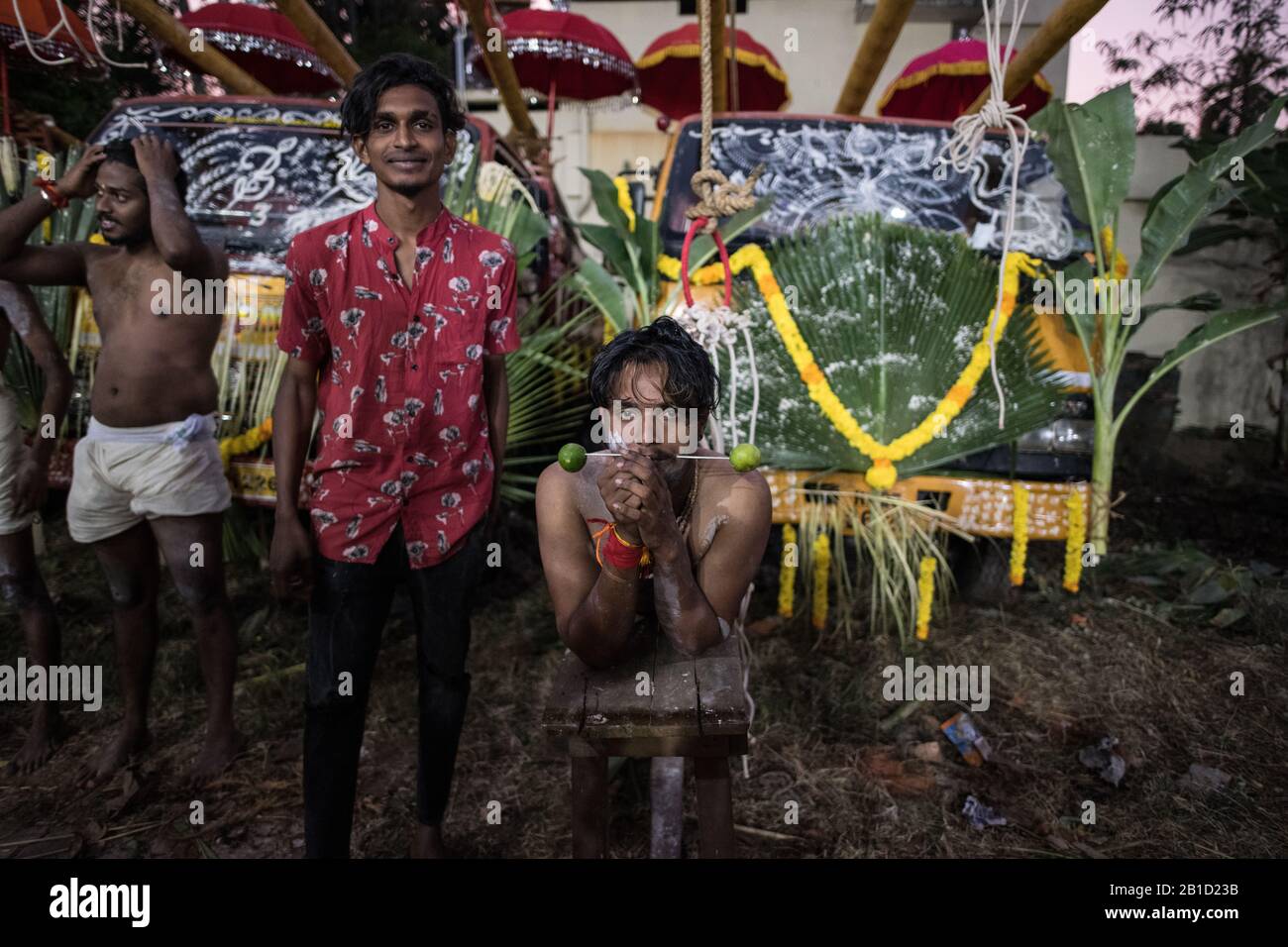 Devotee with spear-pierced mouths (Kavadi Aattam) as an act of devotion during Thaipooyam, or Thaipoosam, Festival in Kedakulam, Kerala. Stock Photo