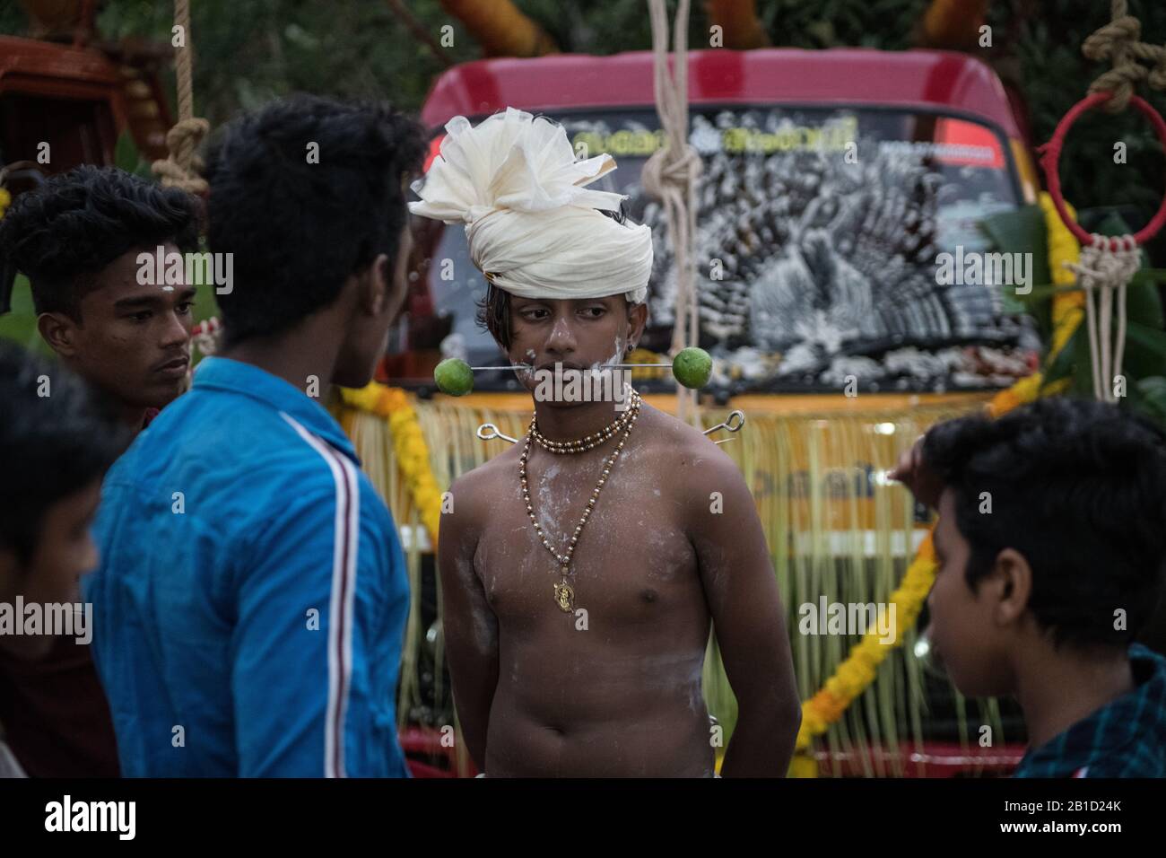 Devotee with spear-pierced mouths (Kavadi Aattam) as an act of devotion during Thaipooyam, or Thaipoosam, Festival in Kedakulam, Kerala. Stock Photo