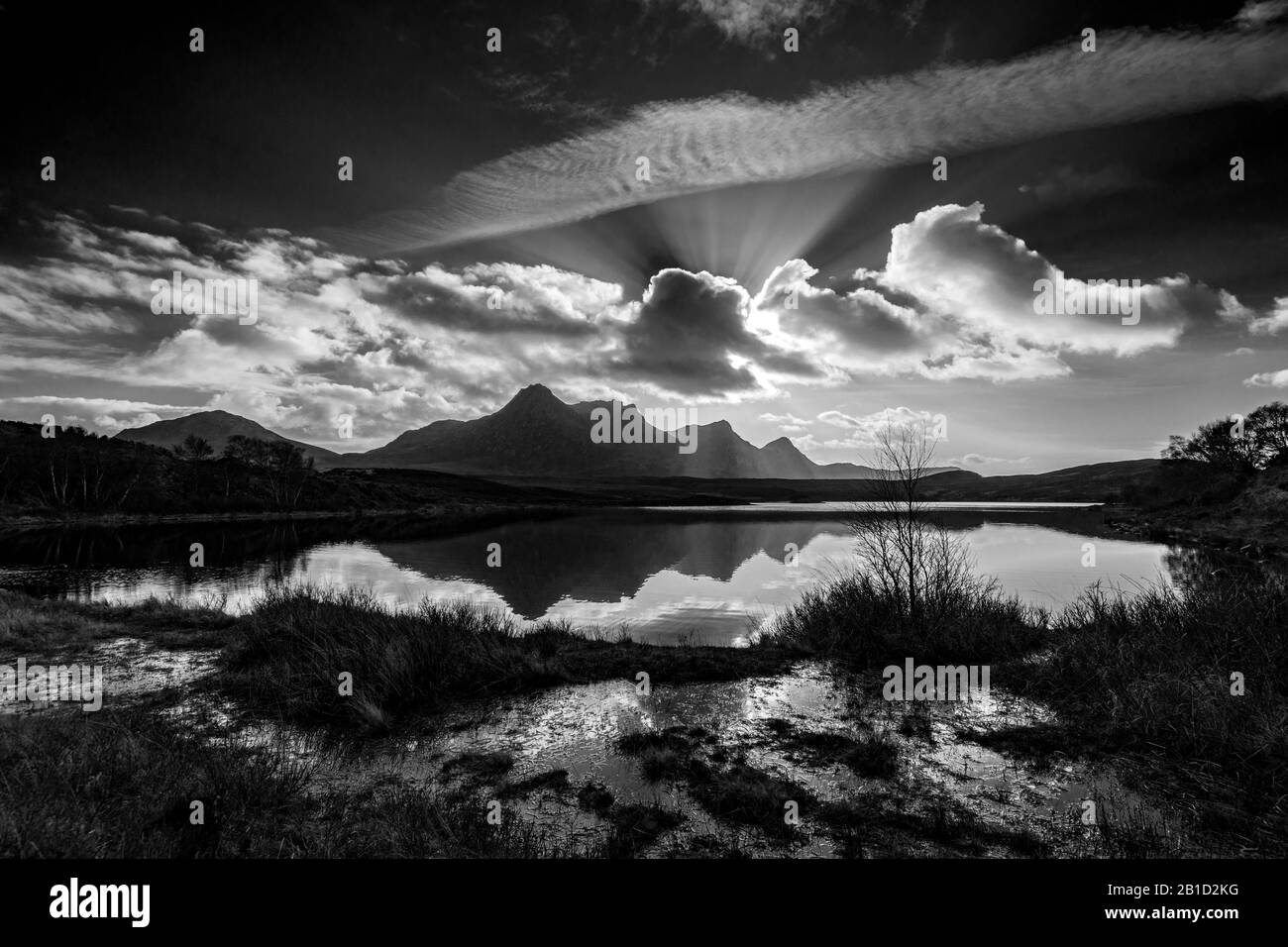 Ben Loyal reflected in Lochan Hakel.  Near Tongue, Sutherland, Scotland, UK Stock Photo