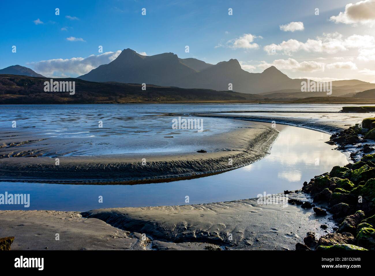 Ben Loyal over the mud flats at the head of the Kyle of Tongue at low tide, Sutherland, Scotland, UK Stock Photo
