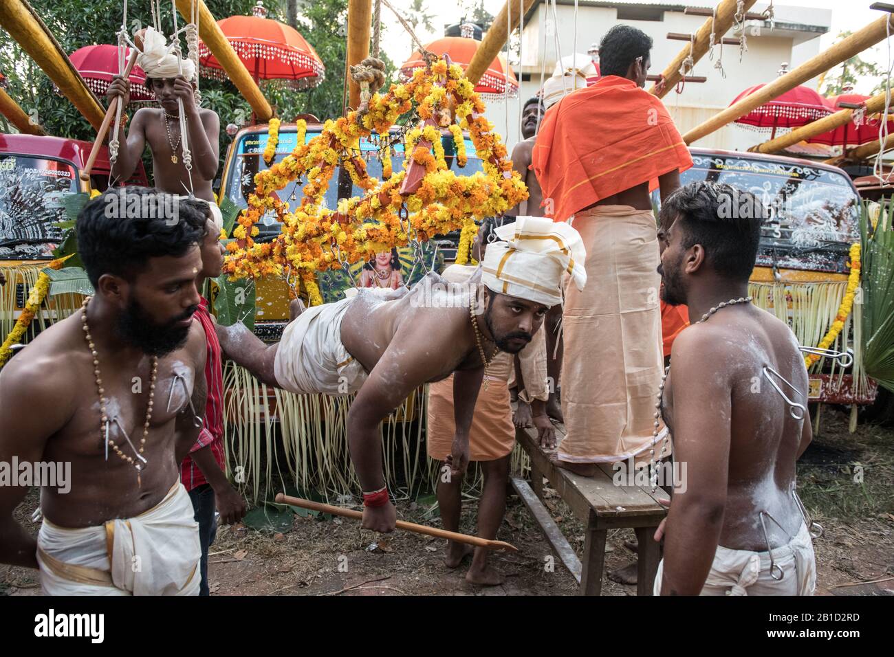 Devotee hanging by hook piercings as a ritualistic act of devotion