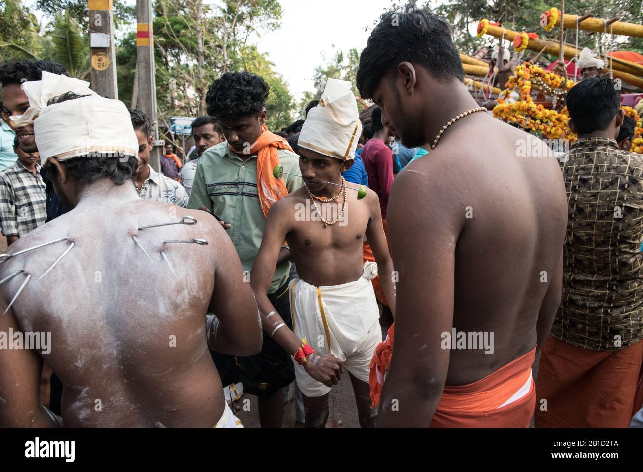 Devotee with spear-pierced mouths (Kavadi Aattam) as an act of devotion during Thaipooyam, or Thaipoosam, Festival in Kedakulam, Kerala. Stock Photo