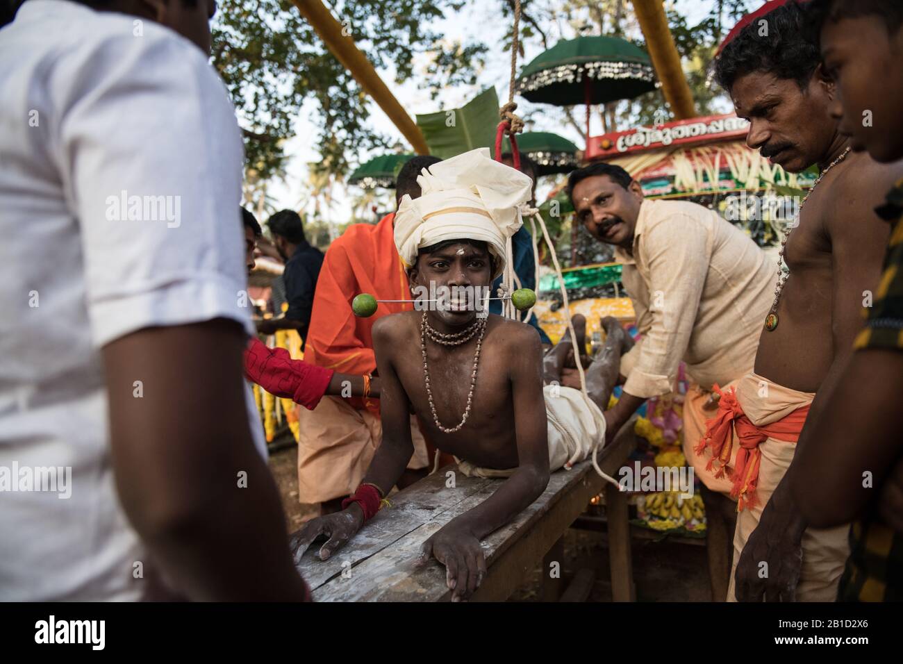 Devotee with spear-pierced mouths (Kavadi Aattam) as an act of devotion during Thaipooyam, or Thaipoosam, Festival in Kedakulam, Kerala. Stock Photo