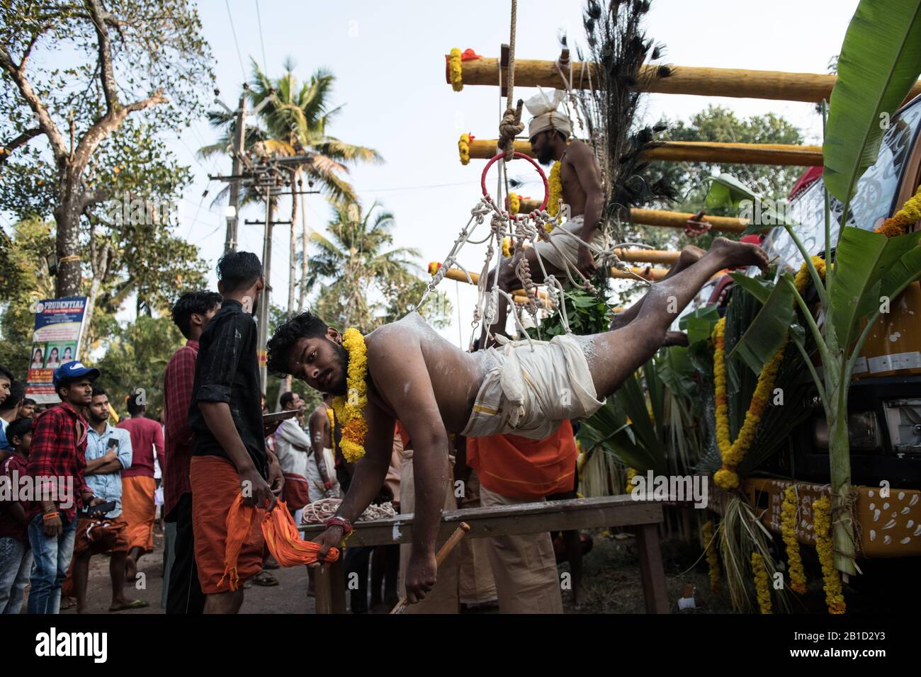 Devotee hanging by hook piercings as a ritualistic act of devotion