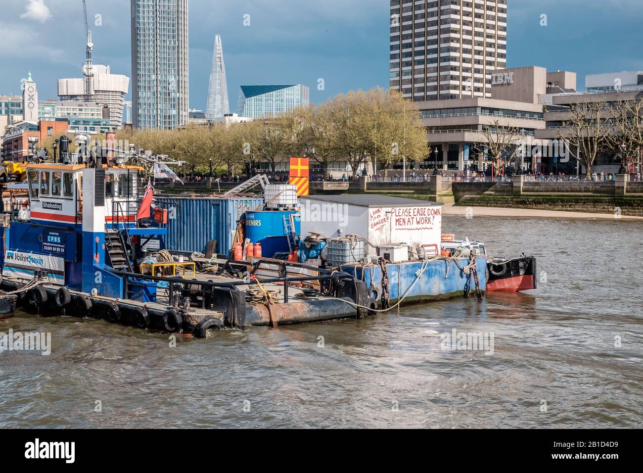 Ferry passing through the south bank of River Thames, London, England Stock Photo