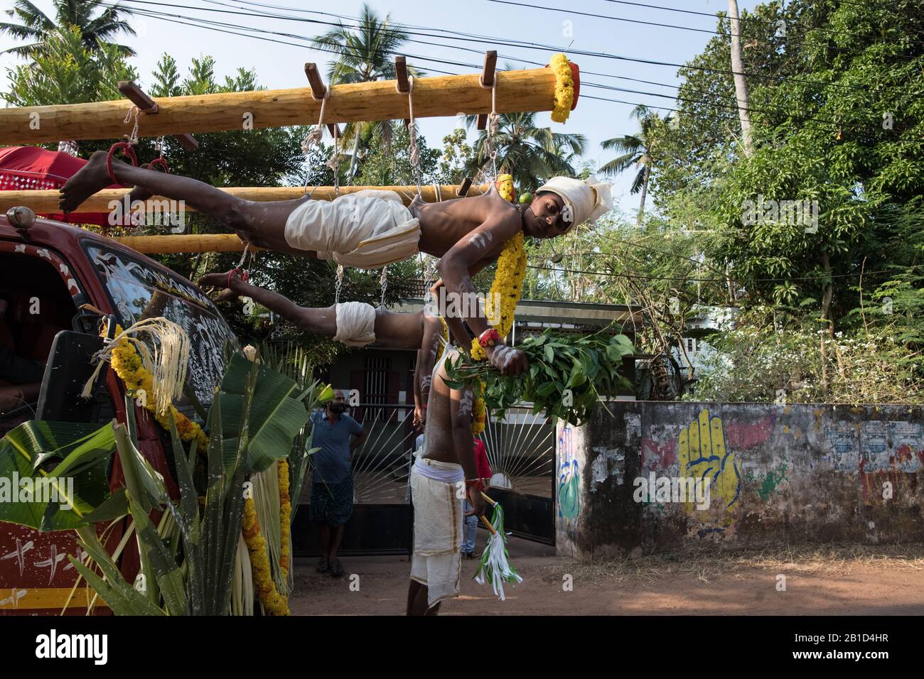 Devotee hanging by hook piercings as a ritualistic act of devotion