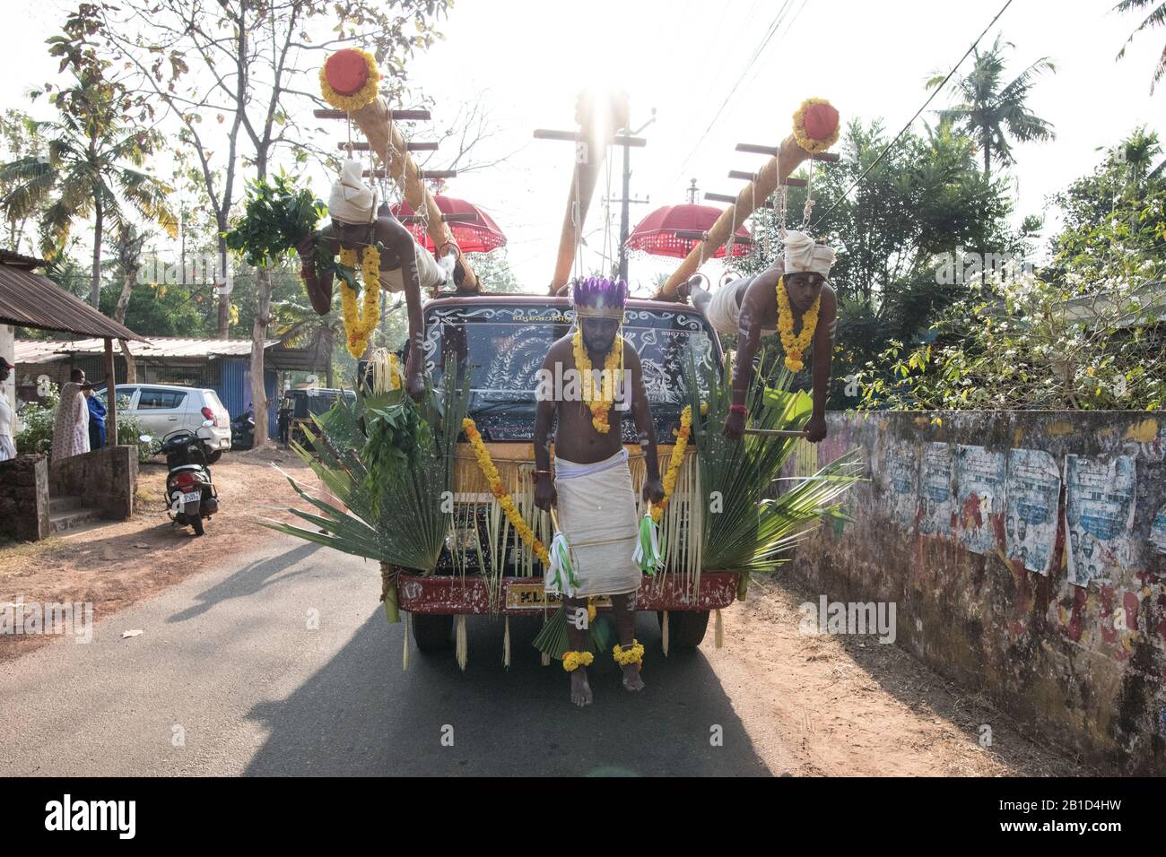 Devotees hanging by hooks piercing their skin as a ritualistic act of