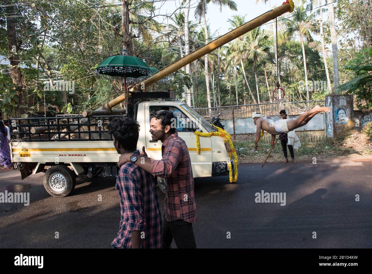 Devotees hanging by hooks piercing their skin as a ritualistic act of devotion, Garudan Thookkam (Eagle Hanging), during Thaipooyam, or Thaipoosam, Fe Stock Photo