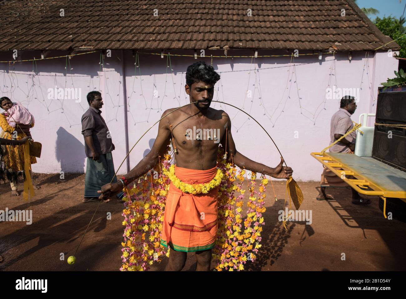 Devotee with spear-pierced mouths (Kavadi Aattam) as an act of devotion during Thaipooyam, or Thaipoosam, Festival in Kedakulam, Kerala. Stock Photo