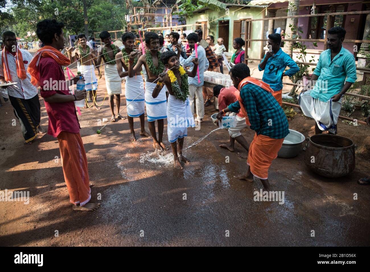 Devotees holding spears in their pierced mouths (Kavadi Aattam) as an act of devotion during Thaipooyam, or Thaipoosam, Festival in Kedakulam, Kerala. Stock Photo