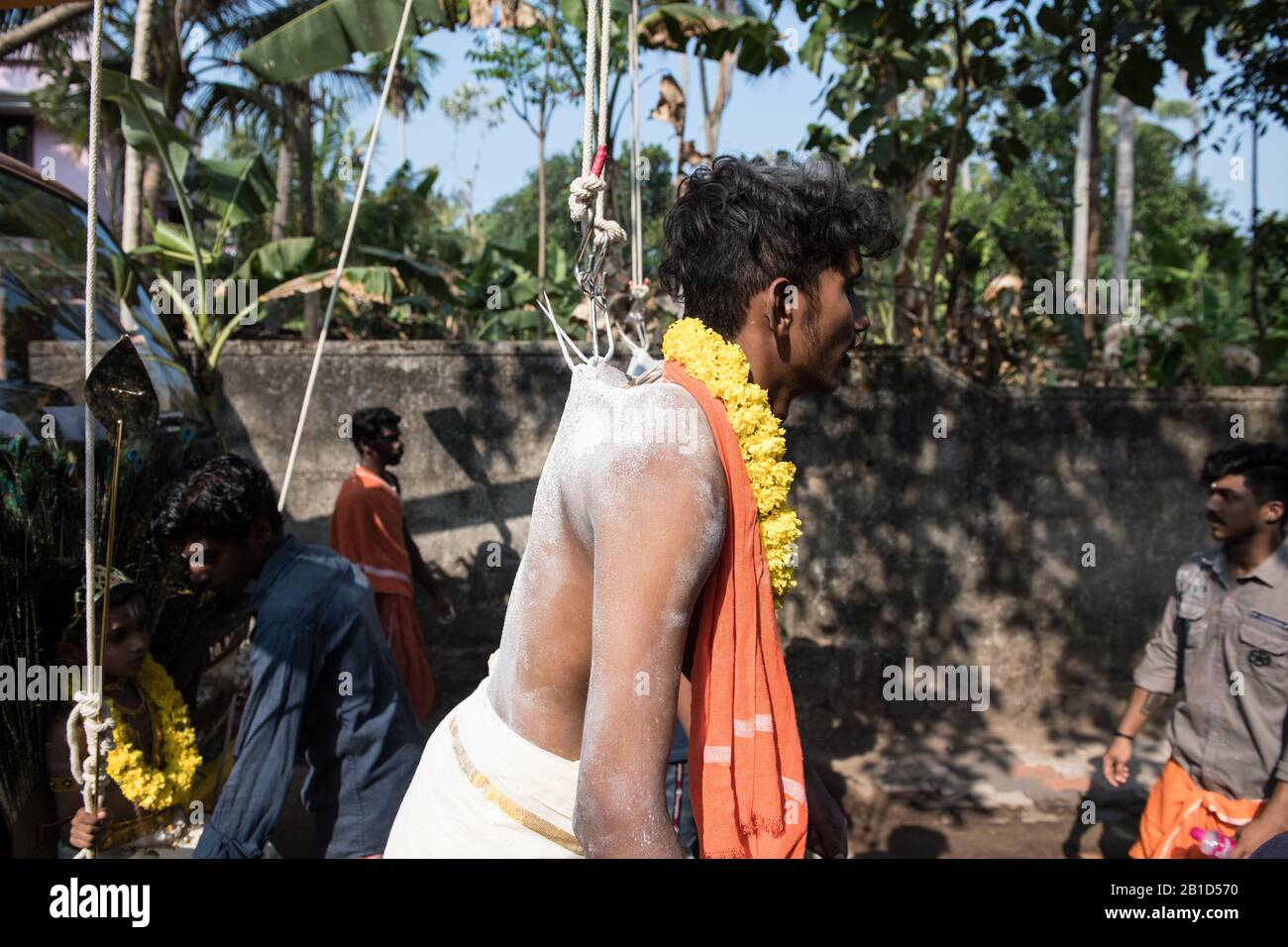 Devotee hanging by hook piercings as a ritualistic act of devotion