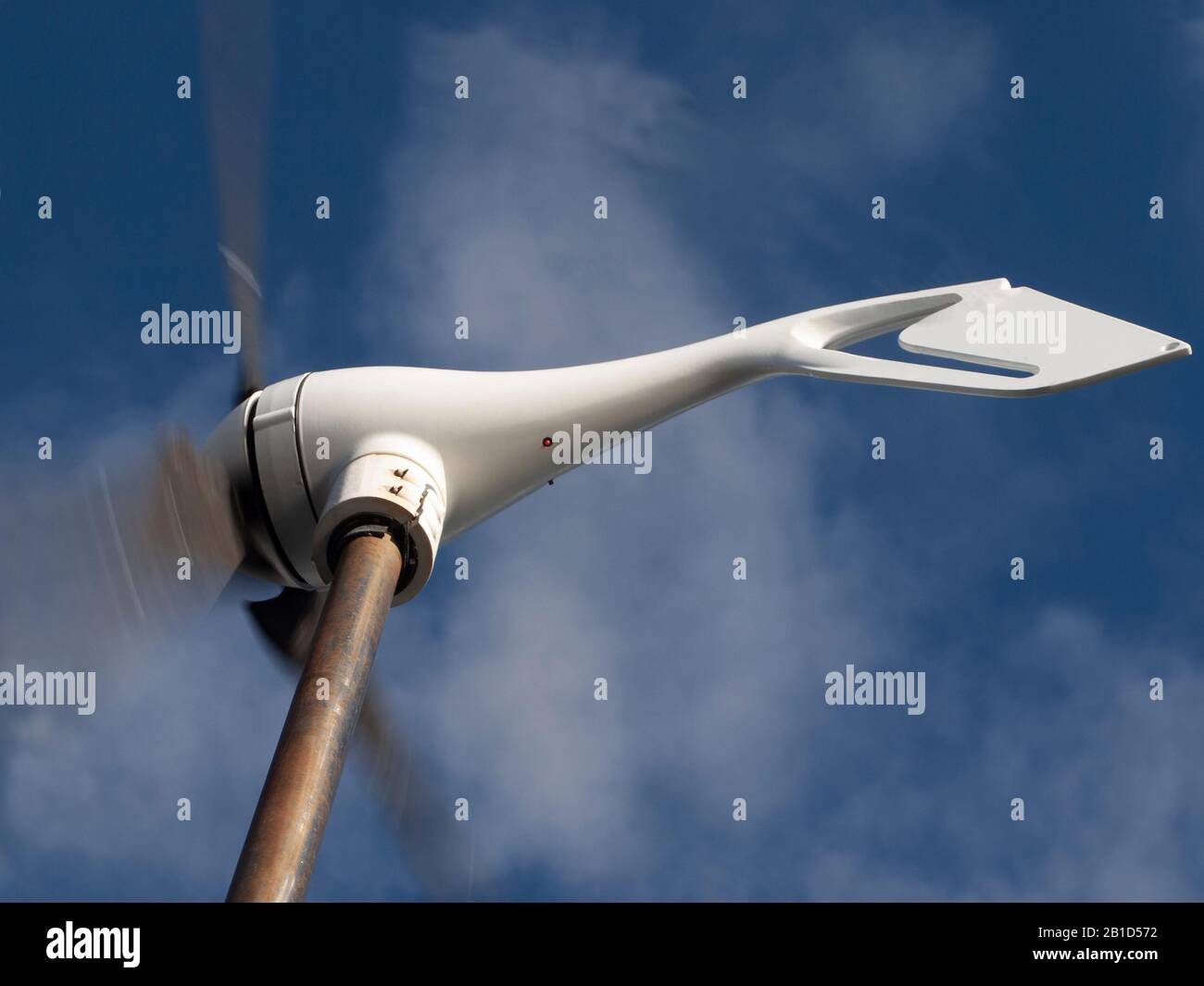 Wind generator generating alternative energy in a nautical and marine environment on a yacht at sea. Queensland, Australia. Photo for commercial use. Stock Photo