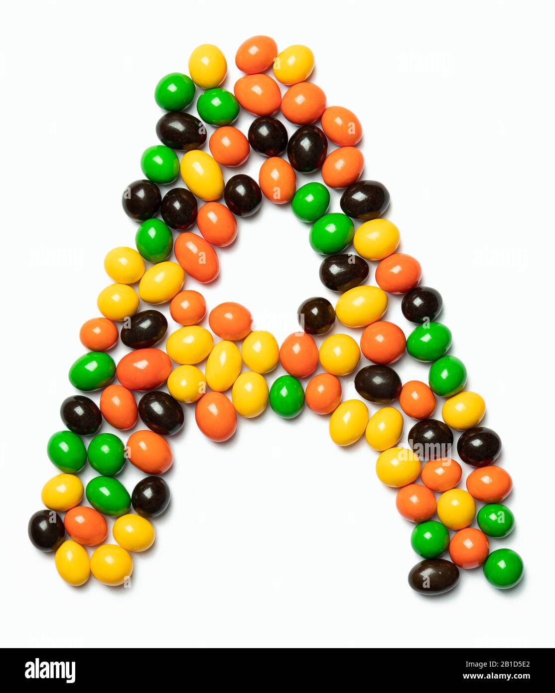 Letter A of the English alphabet from multicolored round chocolates on ...