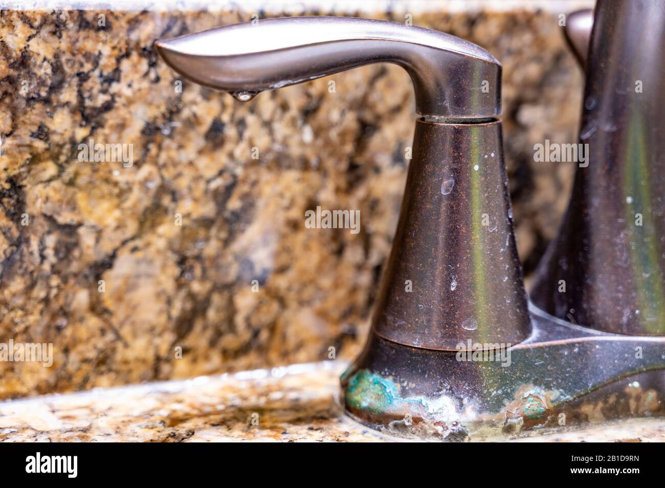corroded and rusted rubbed oil bronze bathroom faucet Stock Photo Alamy