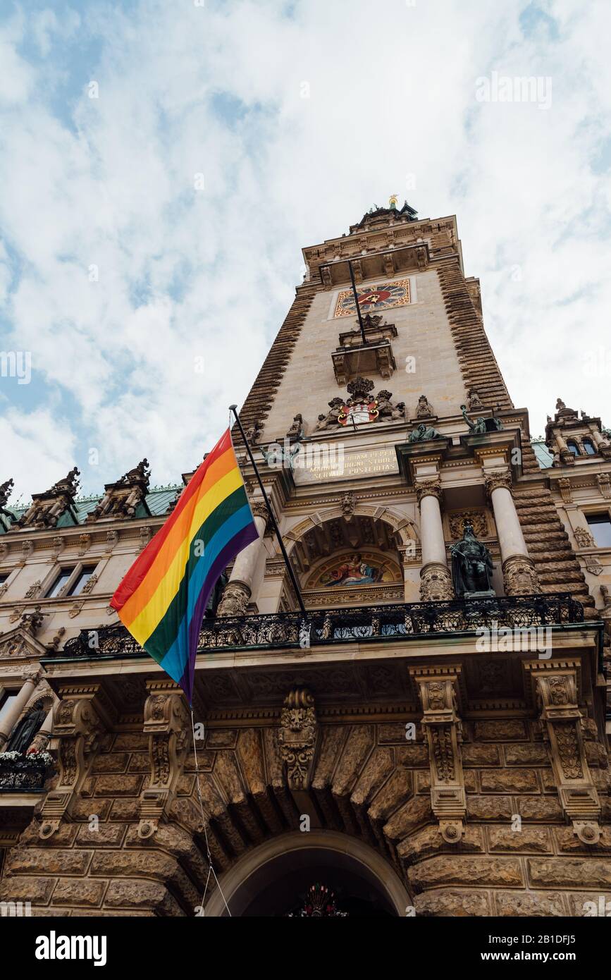 Hamburg Town Hall or Rathaus during Gay Pride Parade. Low angle view against sky Stock Photo