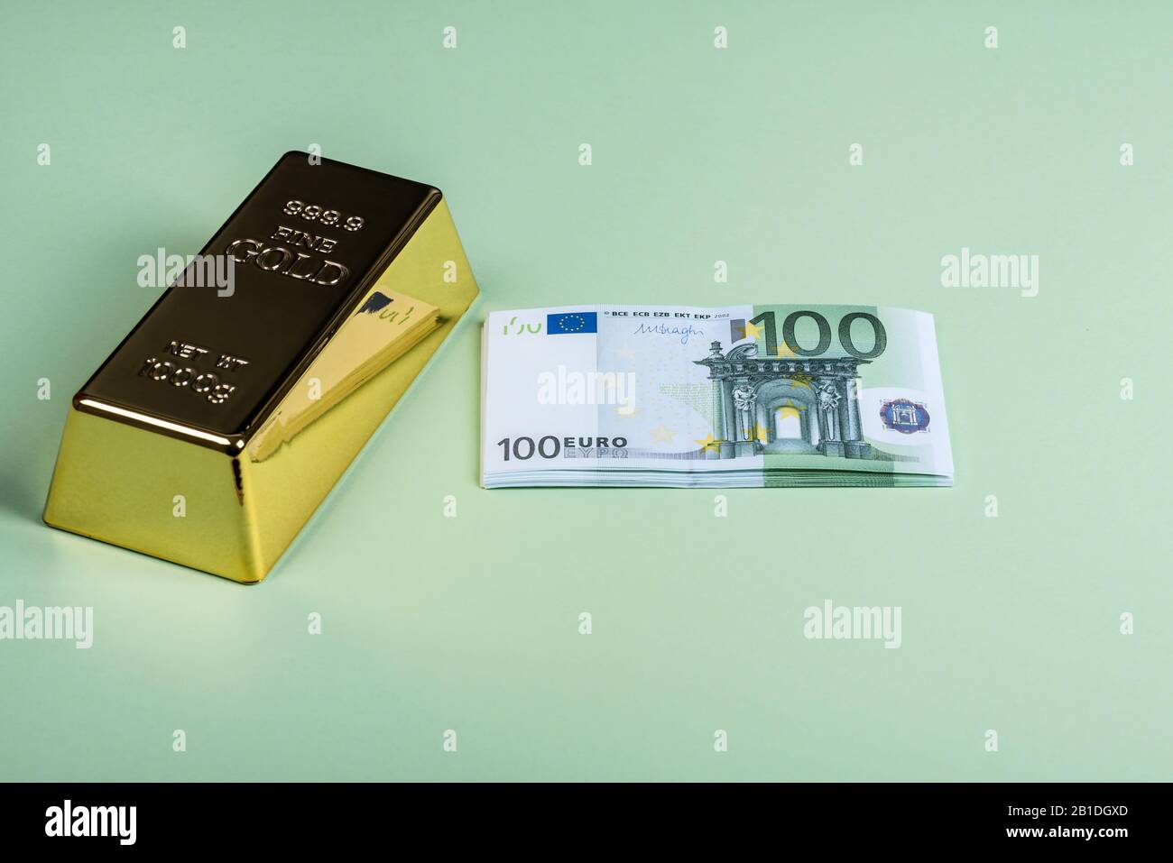 Euro cash and gold bar on a green background. Banknotes. Money. Bill
