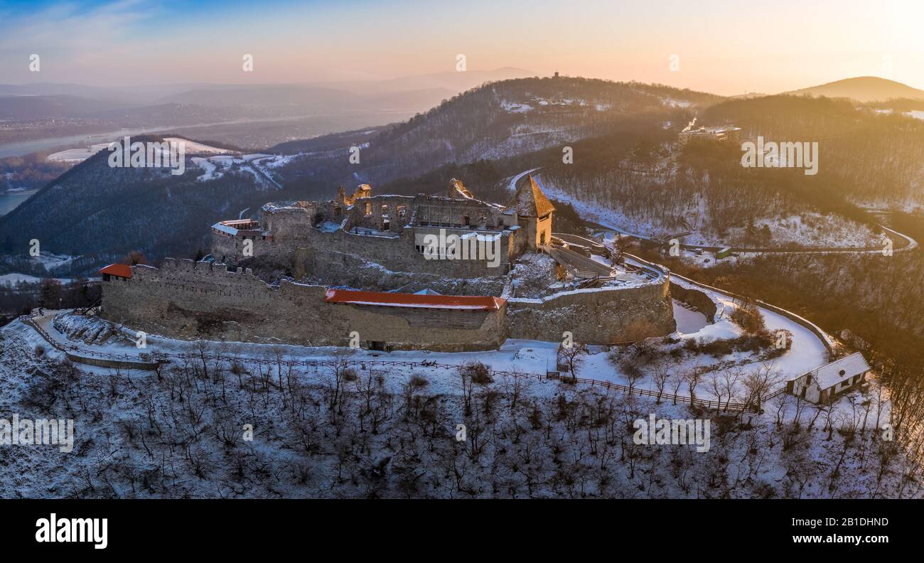 Visegrad, Hungary - Aerial panoramic view of the beautiful old and snowy high castle of Visegrad at sunrise on a winter morning Stock Photo