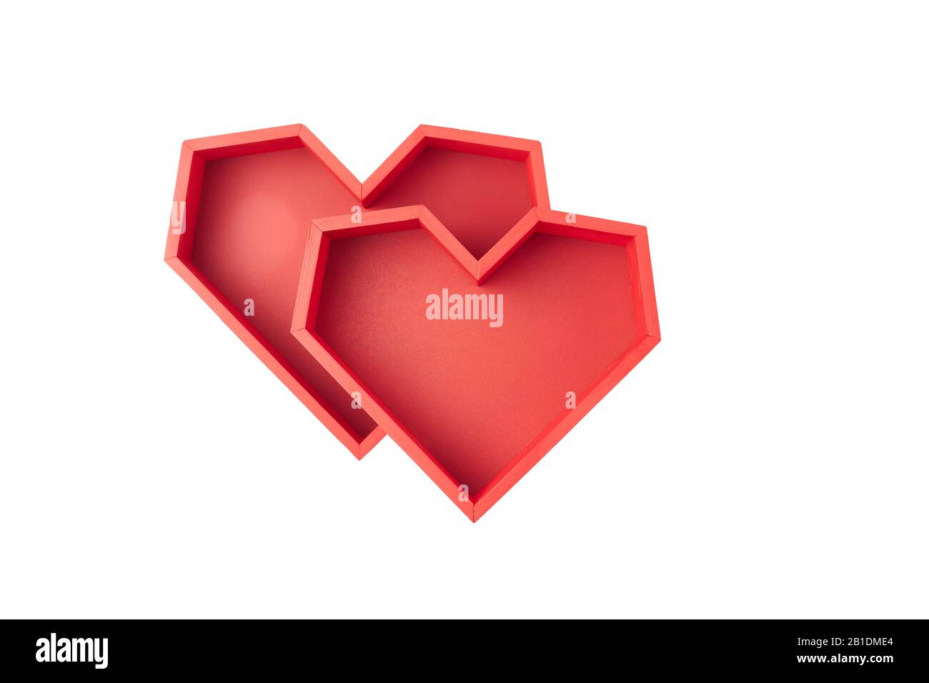 Two red empty boxes in the shape of faceted heart on a white background. Stock Photo