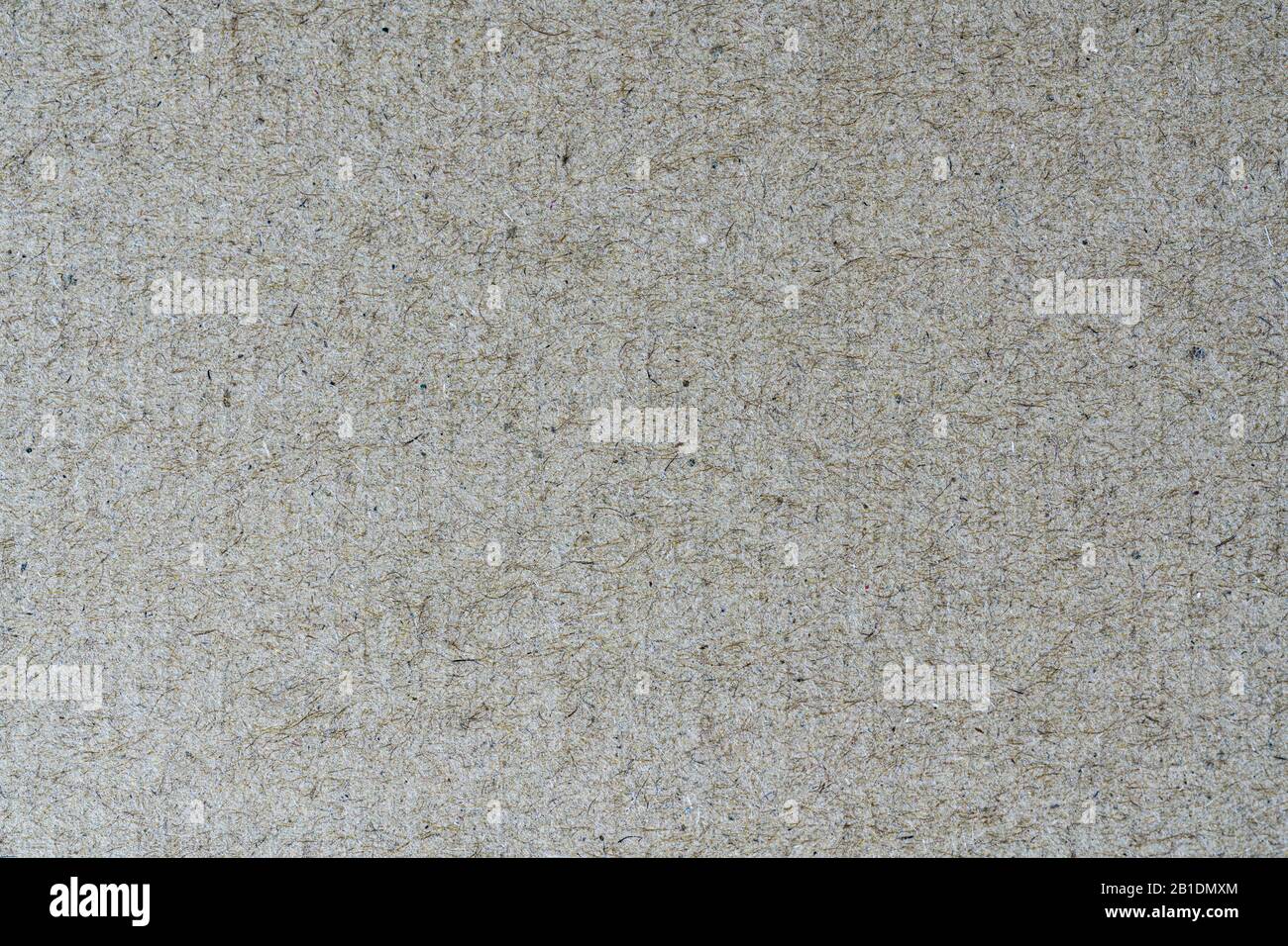Light brown background from sheet of recycled cardboard. Close-up detail view of abstract texture recycled eco-friendly material pattern background Stock Photo