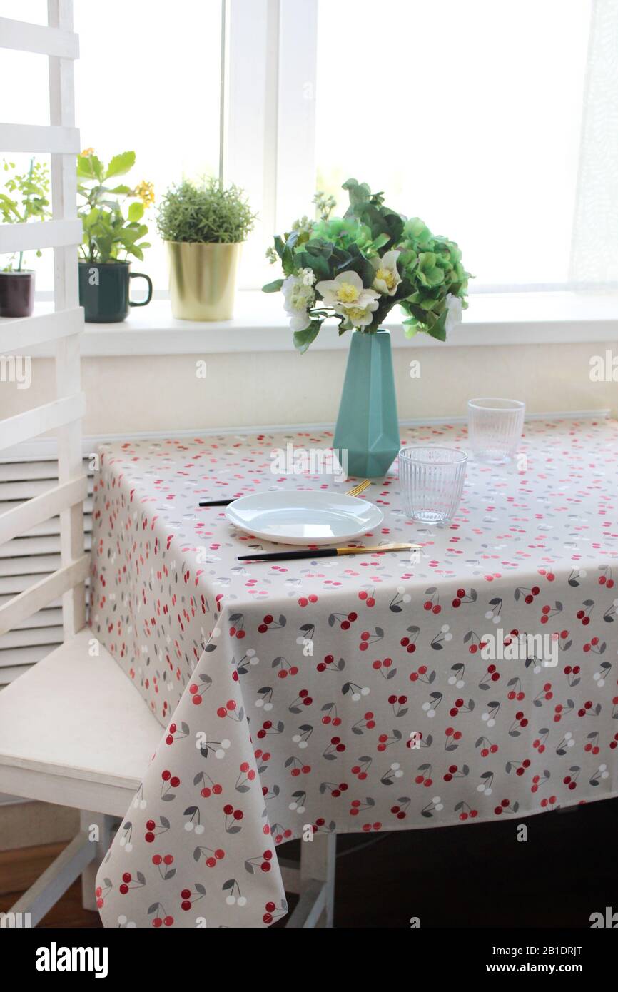 set table with light furniture and dishes Stock Photo Alamy