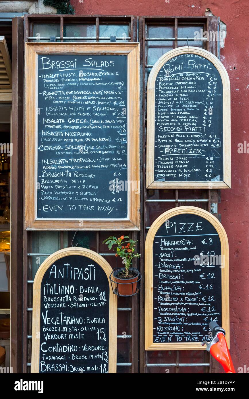Typical menu written on blackboard outside Italian restaurant in Rome, Italy Stock Photo