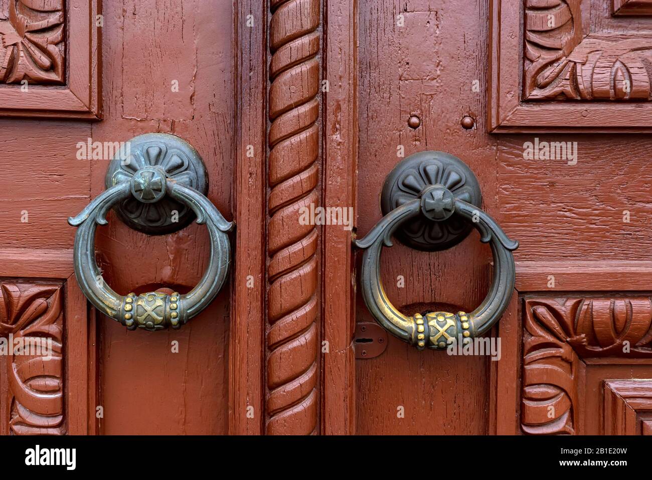 Vintage decorated door handles or knockers round in shape Stock Photo