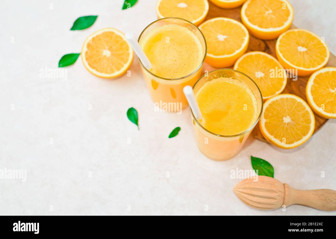 halves of oranges sliced for making orange juice Stock Photo