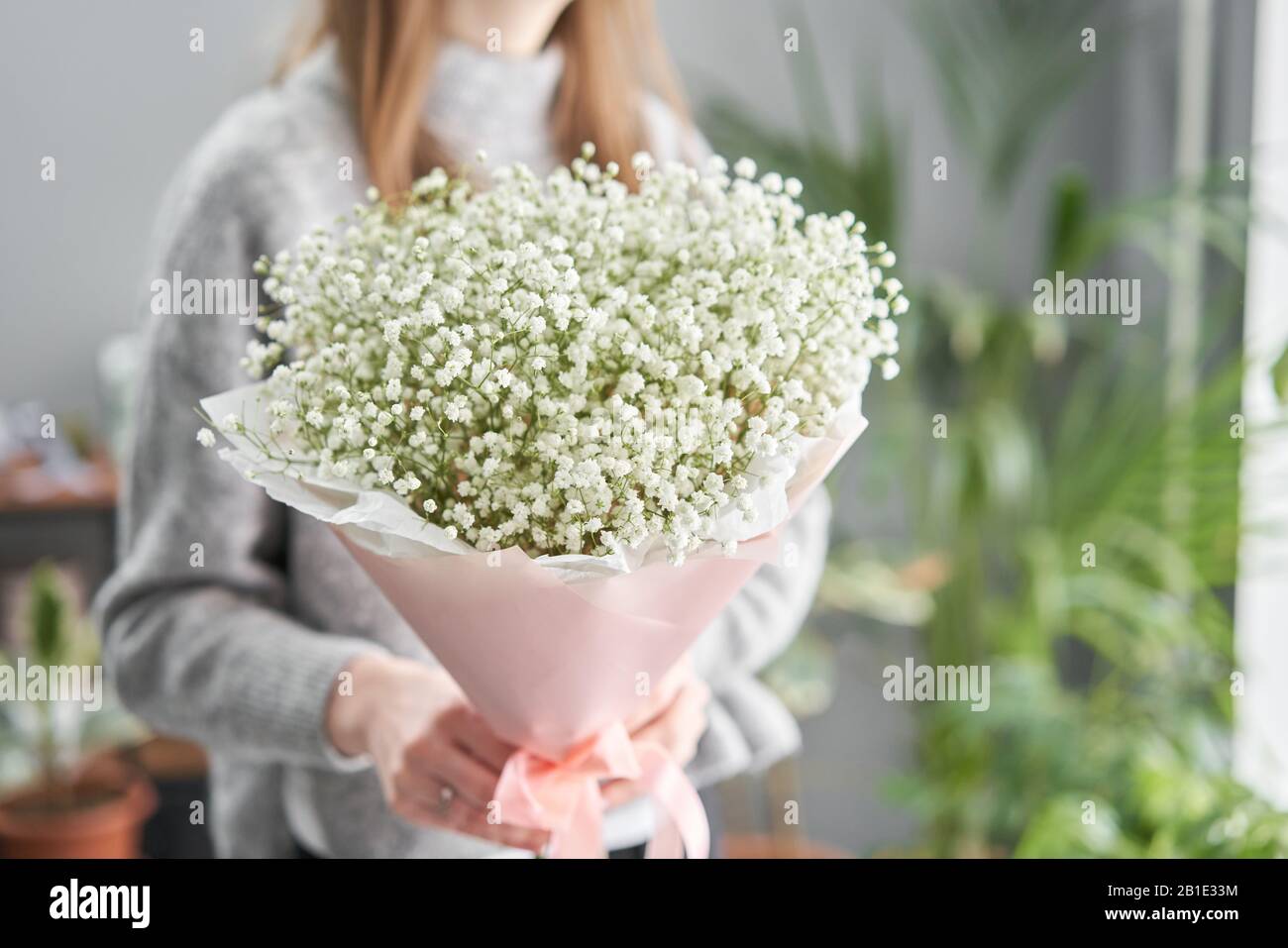 White Gypsophila Beautiful Bouquet Of Mixed Flowers In Womans Hands The Work Of The Florist At A Flower Shop Fresh Cut Flower Stock Photo Alamy