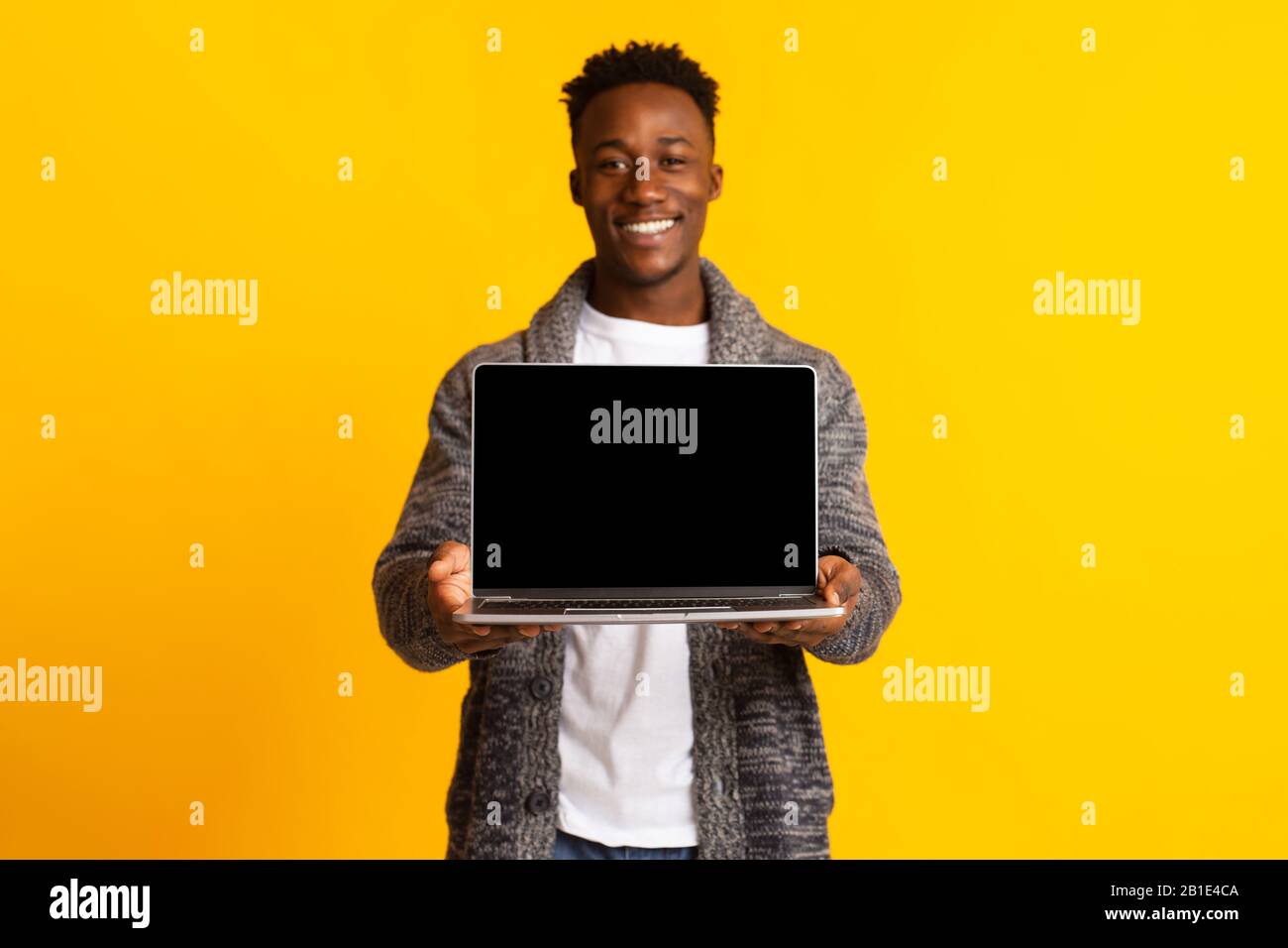 African man holding in hi-res stock photography and images - Alamy