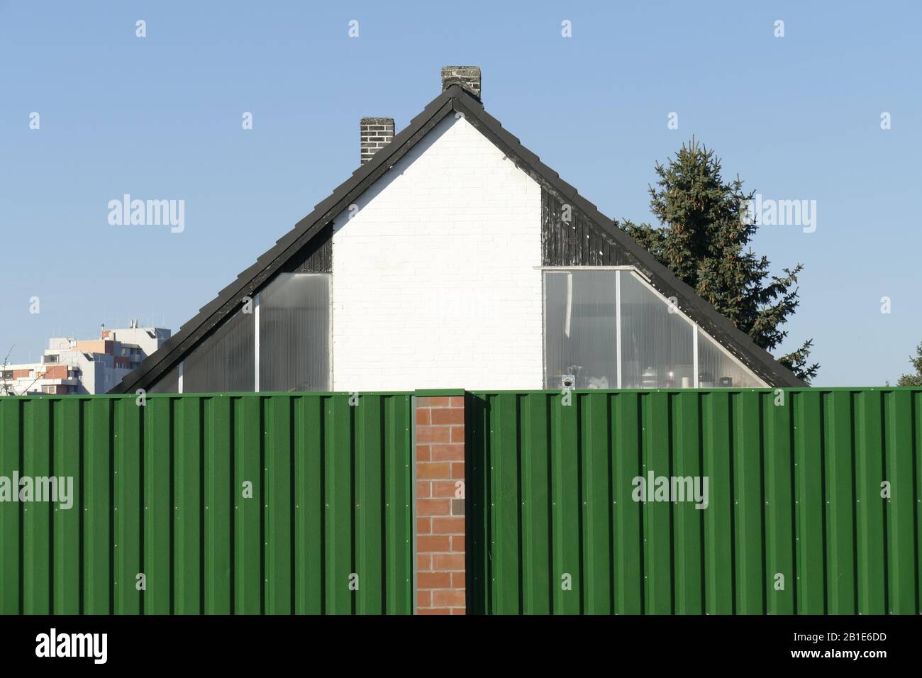 Noise barrier on a street with residential buildings, Bremen, Germany Stock Photo