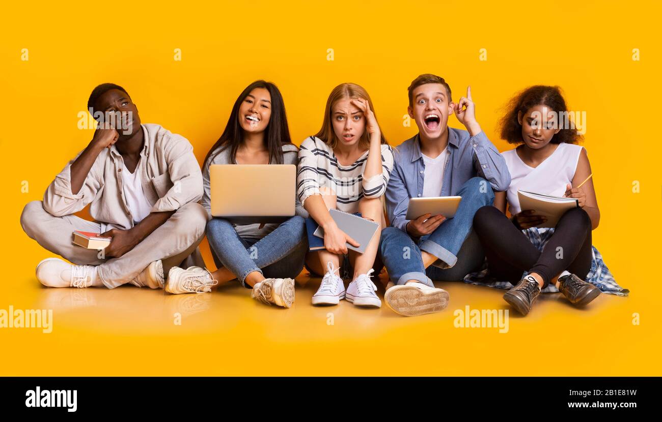 Group of exhausted students studying for school exams Stock Photo