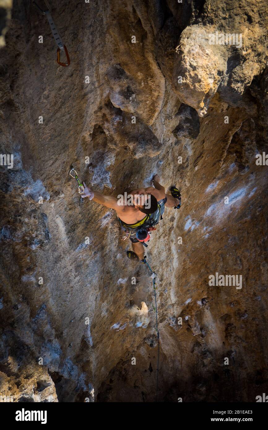 Man Leading Rock Climbing Route, in Kalymnos, Greece. Stock Photo