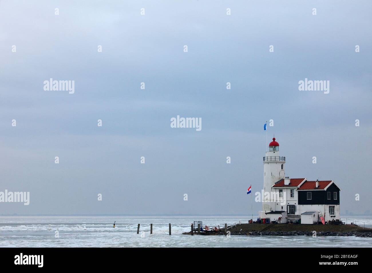Lighthouse Paard van Marken with drifting ice in winter, Netherlands, Northern Netherlands, Markermeer Stock Photo