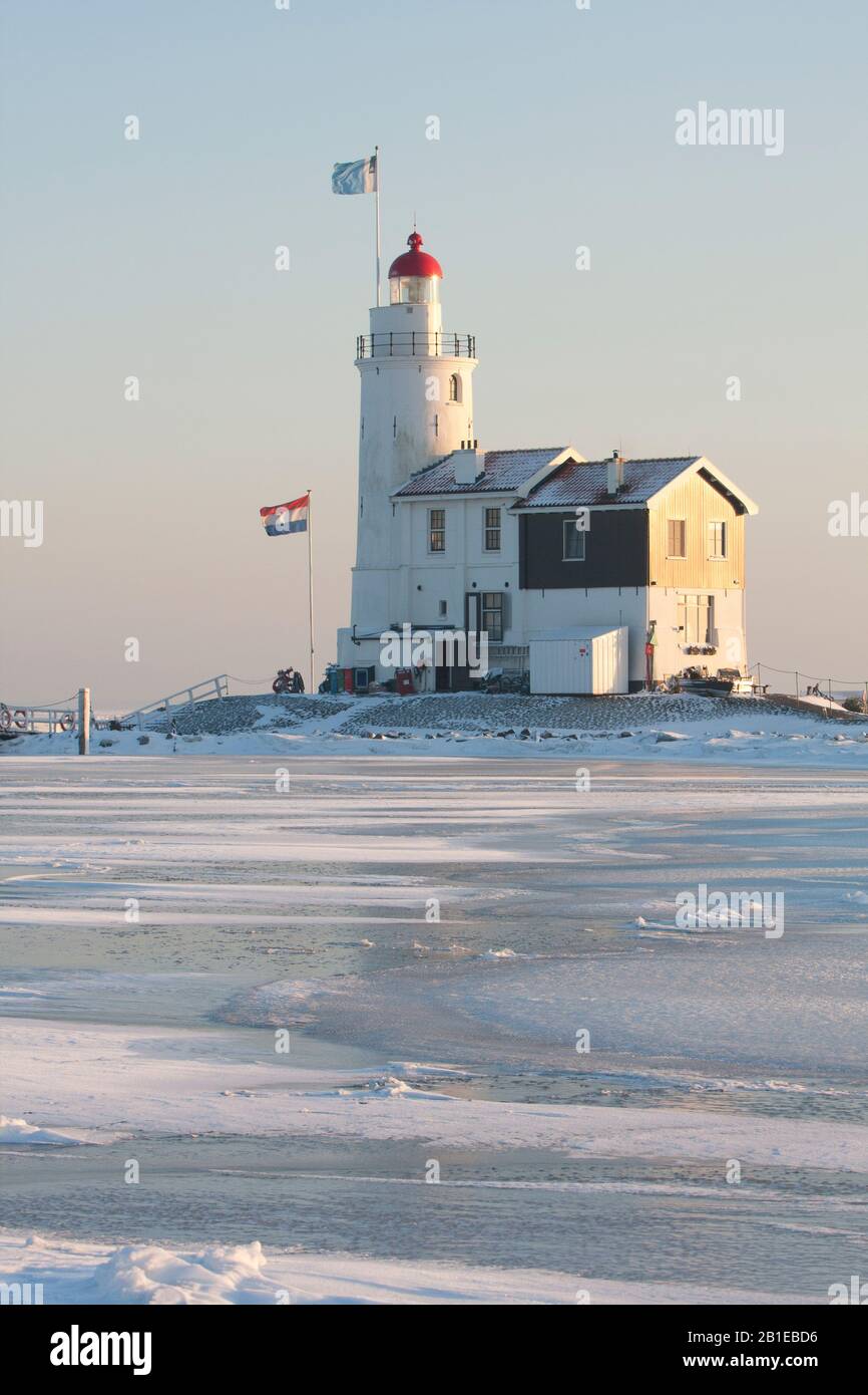 Lighthouse Paard van Marken with drifting ice , Netherlands, Northern Netherlands, Markermeer Stock Photo