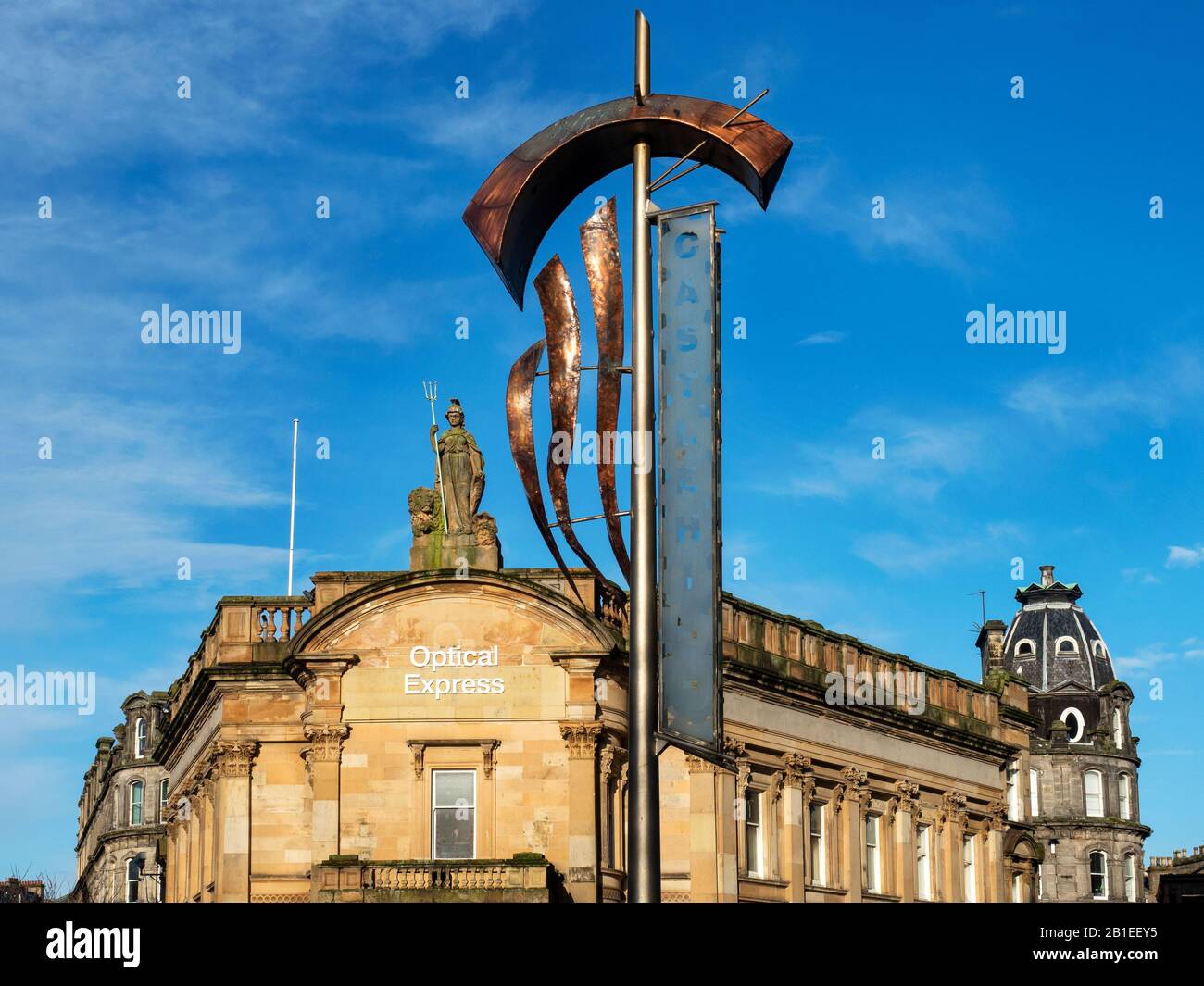 Former Clydesdale Bank Building topped by Britannia statue and Castle Hill banner on High Street Dundee Scotland Stock Photo