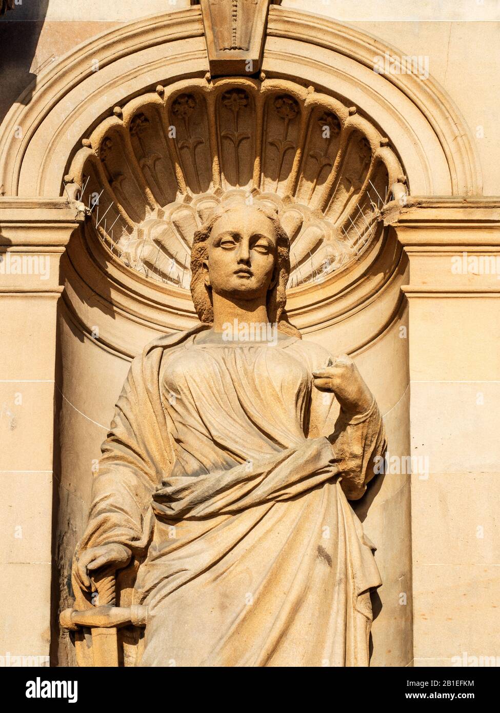 Detail of the statue of Justice with her sword at the former Clydesdale Bank Building High Street Dundee Scotland Stock Photo