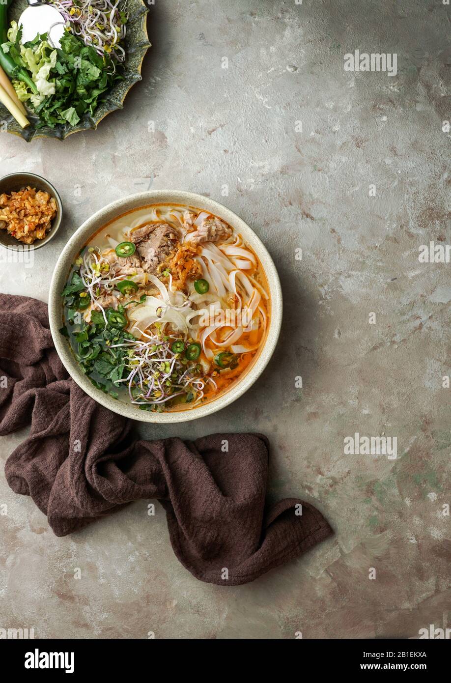 Bun Bo Hue, Bun Bo, Vietnamese beef noodle soup spicy. bowl of beef and
