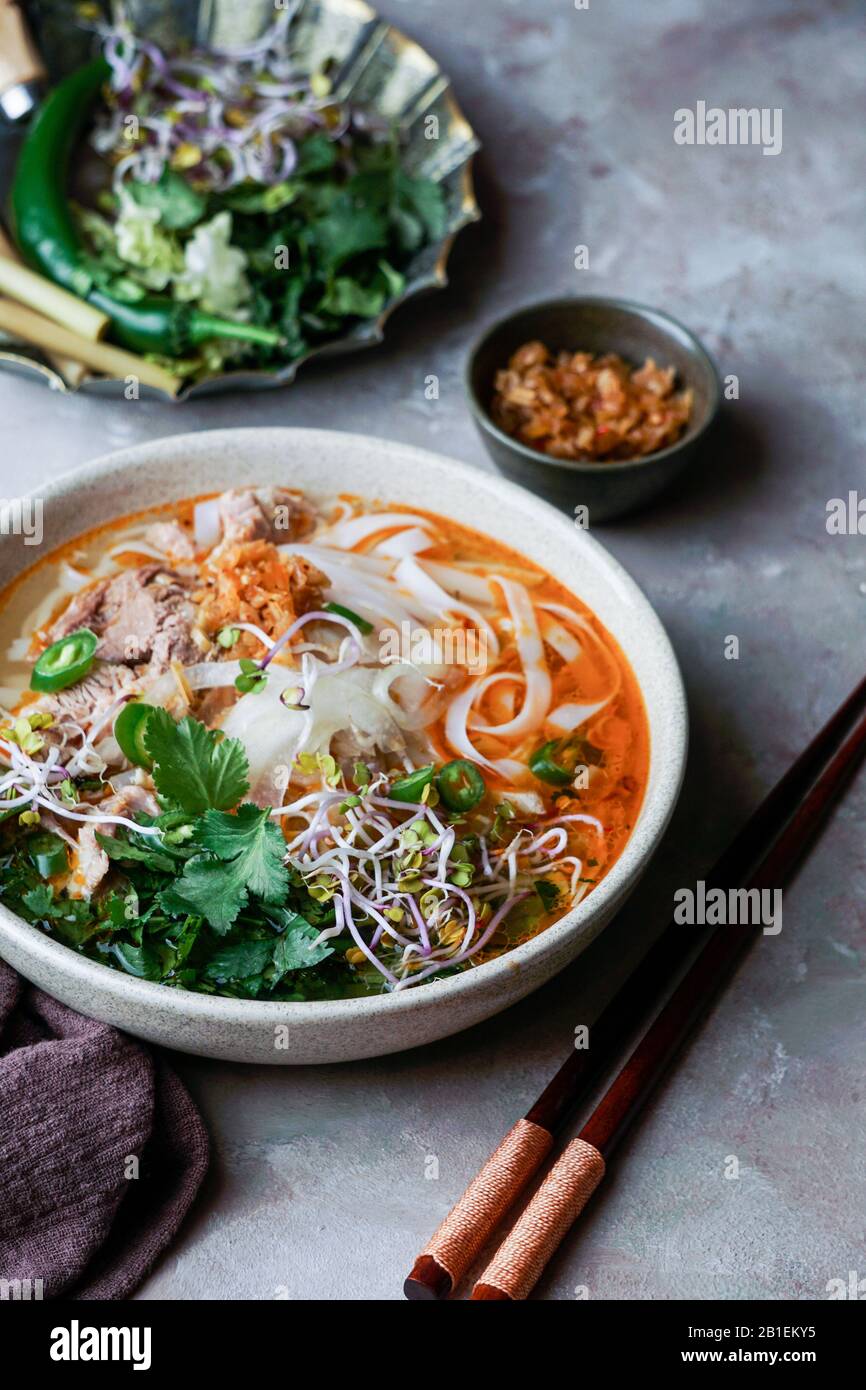 Bun Bo Hue, Bun Bo, Vietnamese beef noodle soup spicy. bowl of beef and