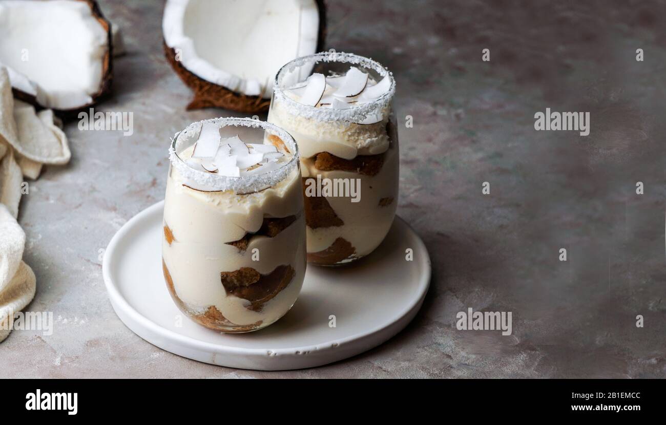 tiramisu with coconut in glass, typical desert of Latin America region, Cuba and Colombia, tarta de coco Stock Photo