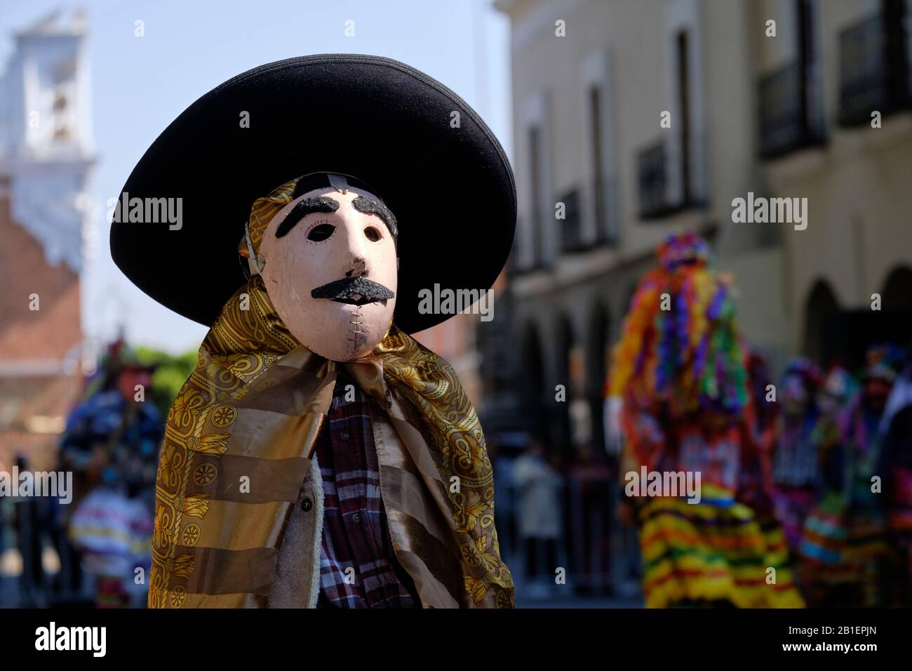 Portrait of A young boy in cowboy outfit, part of a Litter of Chivarrudos, a type of Huehues in traditional Mexican costumes at Tlaxcala Carnival. Stock Photo