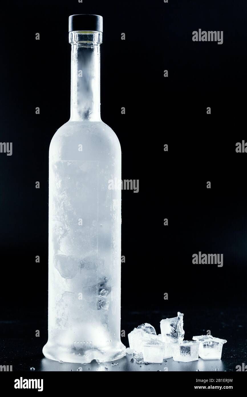 Bottle of cold vodka on dark background Stock Photo Alamy