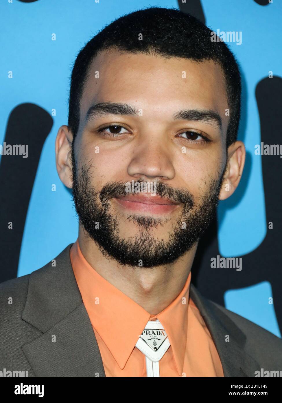 HOLLYWOOD, LOS ANGELES, CALIFORNIA, USA - FEBRUARY 24: Actor Justice Smith  wearing Prada arrives at the Los Angeles Special Screening Of Netflix's  'All The Bright Places' held at ArcLight Hollywood on February