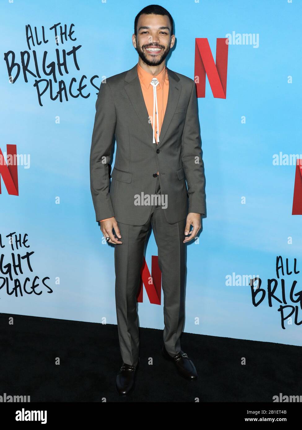 Hollywood, United States. 24th Feb, 2020. HOLLYWOOD, LOS ANGELES,  CALIFORNIA, USA - FEBRUARY 24: Actor Justice Smith wearing Prada arrives at  the Los Angeles Special Screening Of Netflix's 'All The Bright Places'