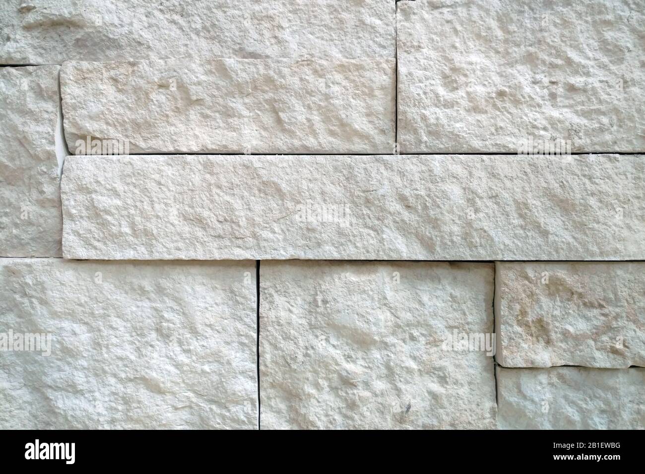 a white block detailed slate rock wall close-up shadowing Stock Photo