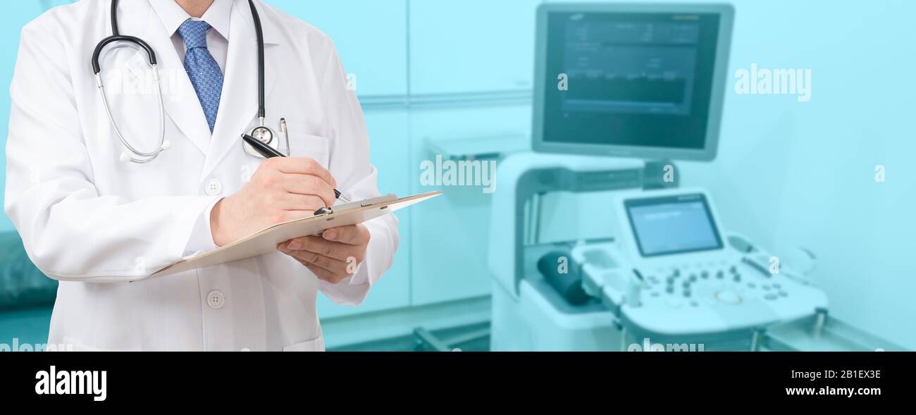 Cropped shot of a male doctor holding a medical chart at the hospital Stock Photo