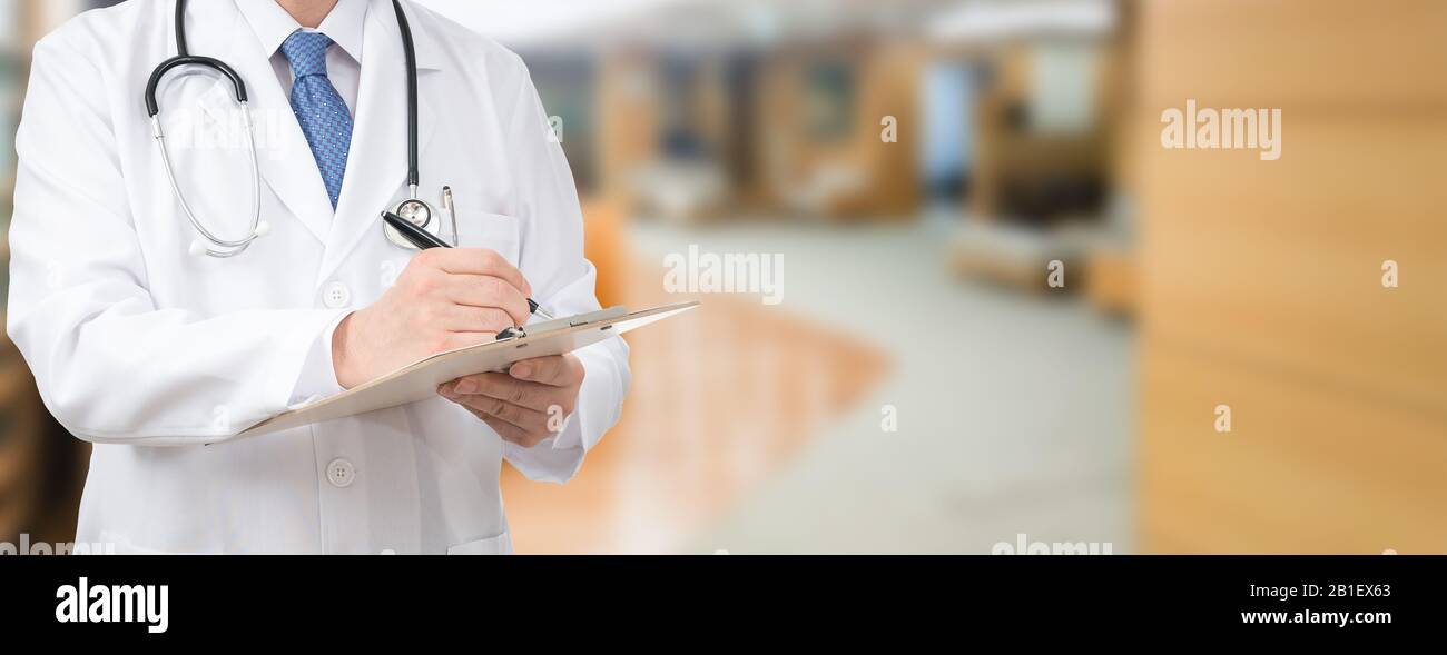 Cropped shot of a male doctor holding a medical chart at the hospital Stock Photo
