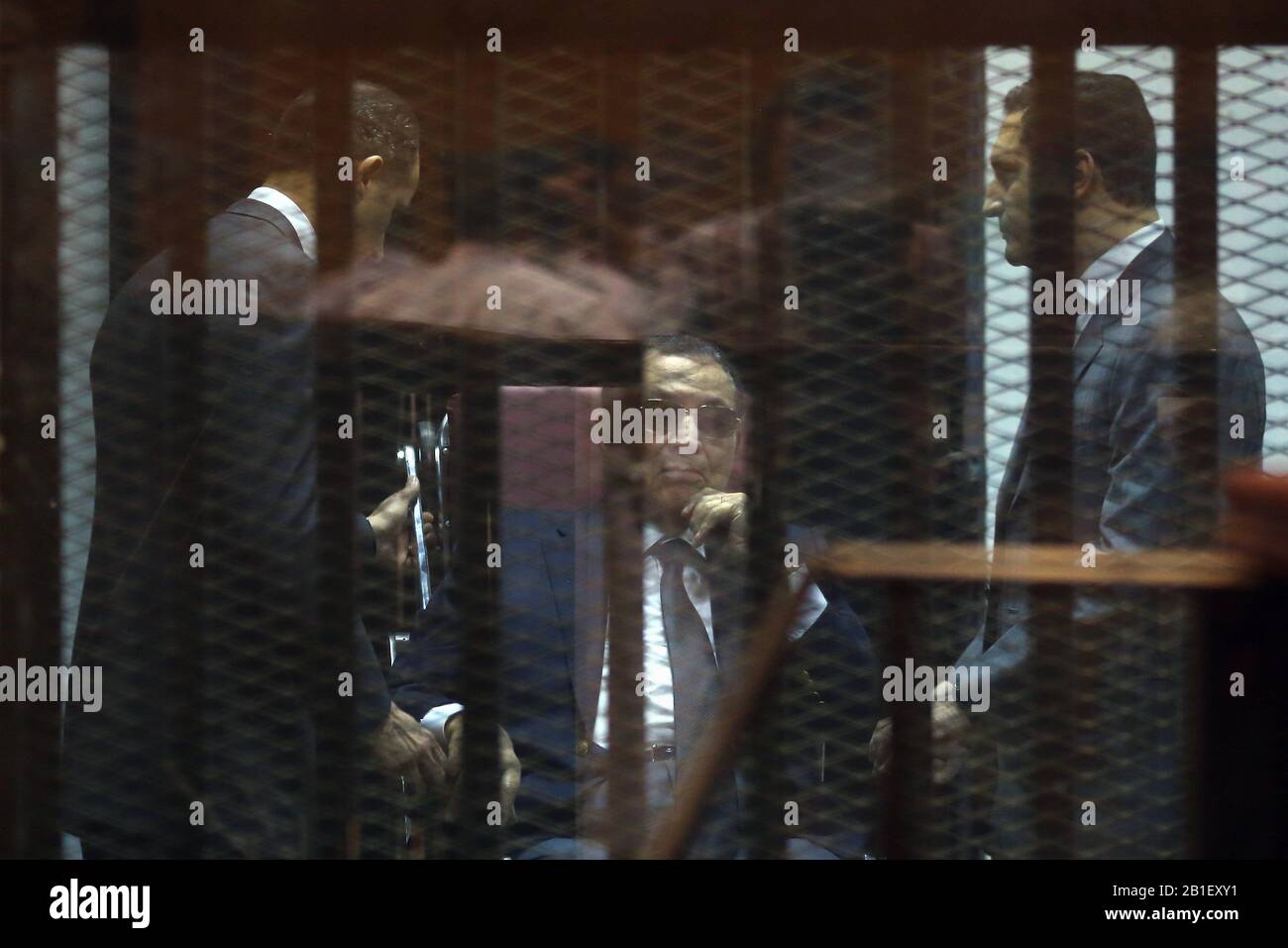 Cairo. 9th May, 2015. File photo taken on May 9, 2015 shows Hosni Mubarak (C), his sons Gamal Mubarak (L) and Alaa Mubarak behind the defendants' cage at a court in Cairo, Egypt. Egyptian former President Hosni Mubarak has died at the age of 91 after suffering a long illness, state-run Nile TV reported on Tuesday. Credit: Ahmed Gomaa/Xinhua/Alamy Live News Stock Photo